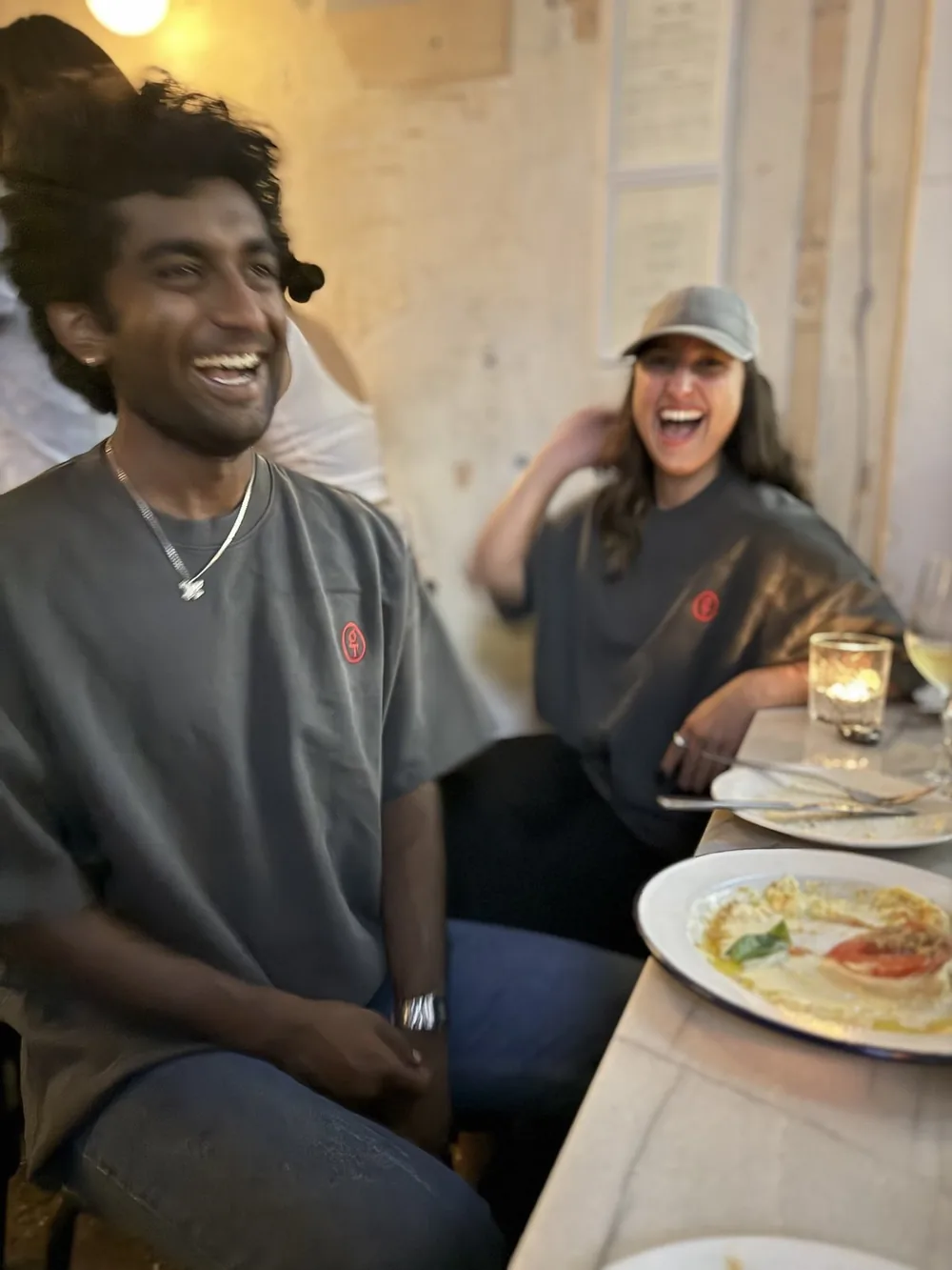 The goodtwin team, laughing at a dinner table